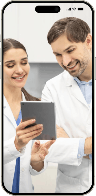 Dentists reviewing patient data together on a tablet device