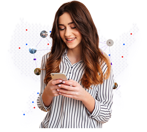 Woman smiling and using mobile phone