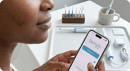 Patient using mobile app to track oral health at home